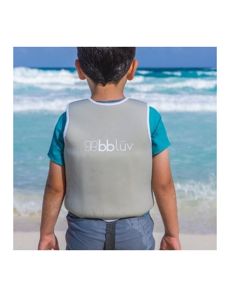 Niño en la playa con Naj chalecto de natación evolutivo de neopreno