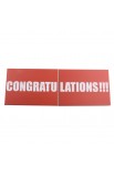 Caja de regalo Sorpresa gris abierta con cartel "Congratulations"